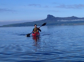 Kayaker with Eigg in background