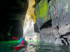 Kayaker in cave